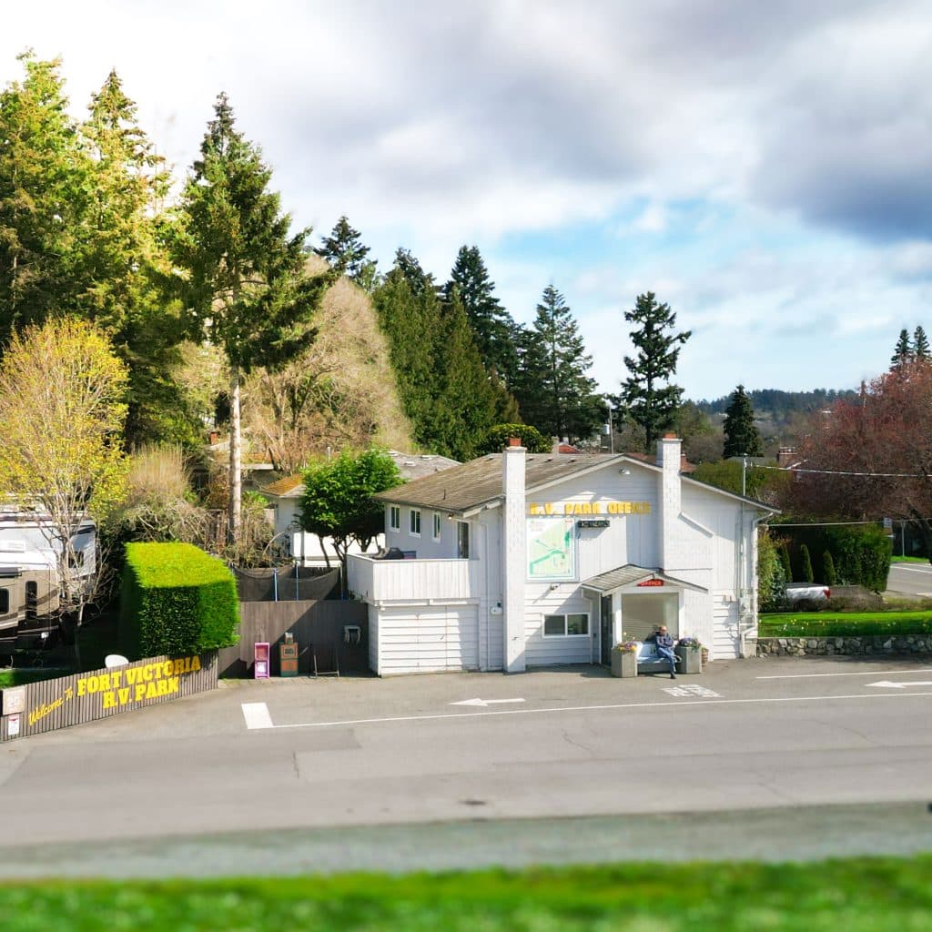 Office driveway at Fort Victoria RV Park with sign and parking.