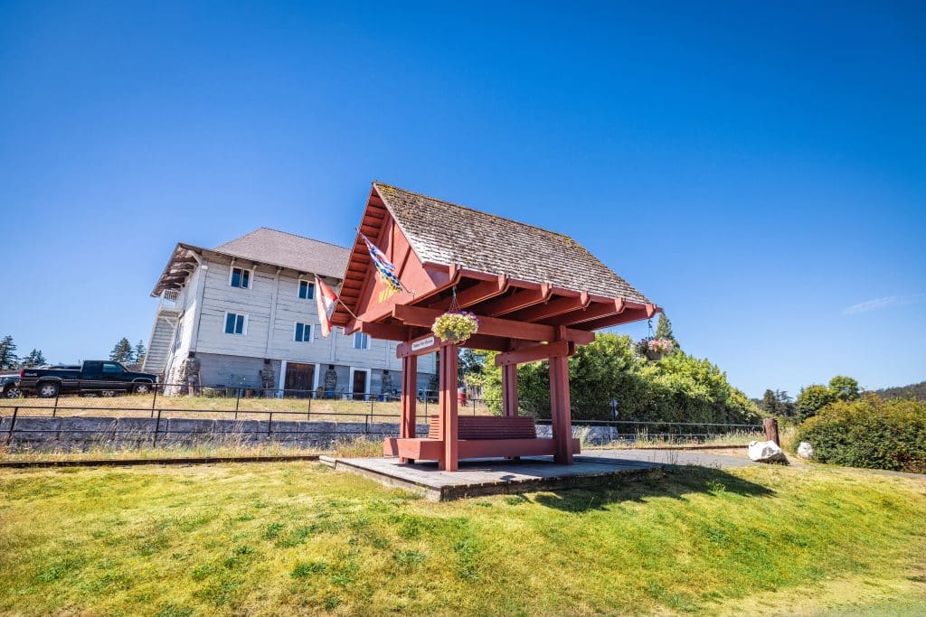 Red-roofed wooden entrance structure at Fort Victoria RV Park