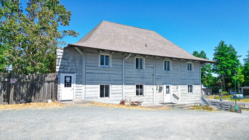 Historic wooden fort building at the entrance of Fort Victoria RV Park in Victoria, BC.
